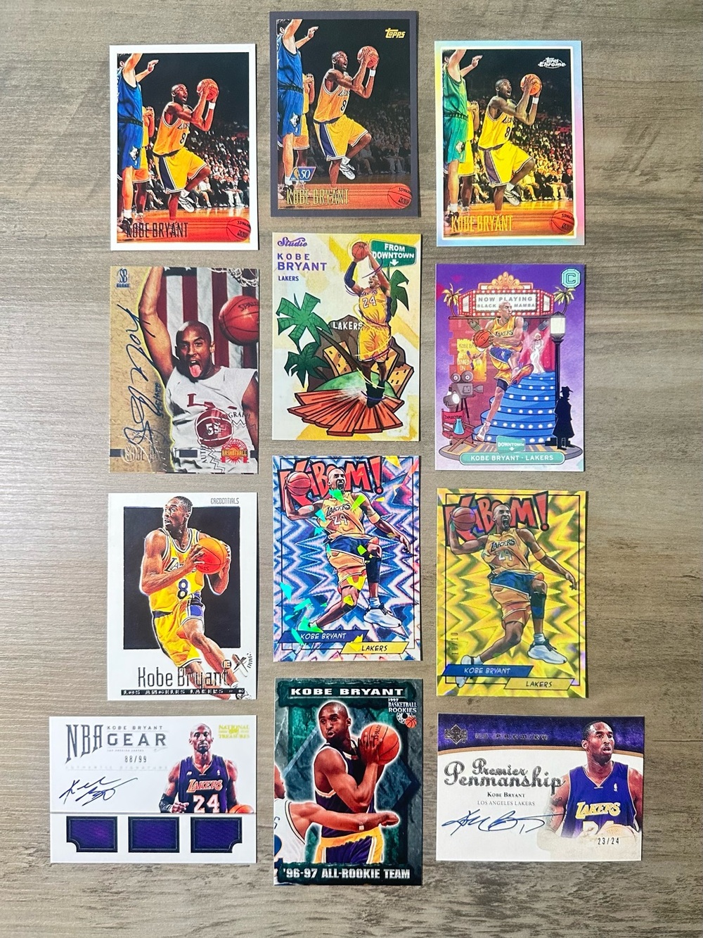 Kobe Bryant Signed Rookie Lot of (12) Topps UD Downtown Kaboom Novelty Cards.